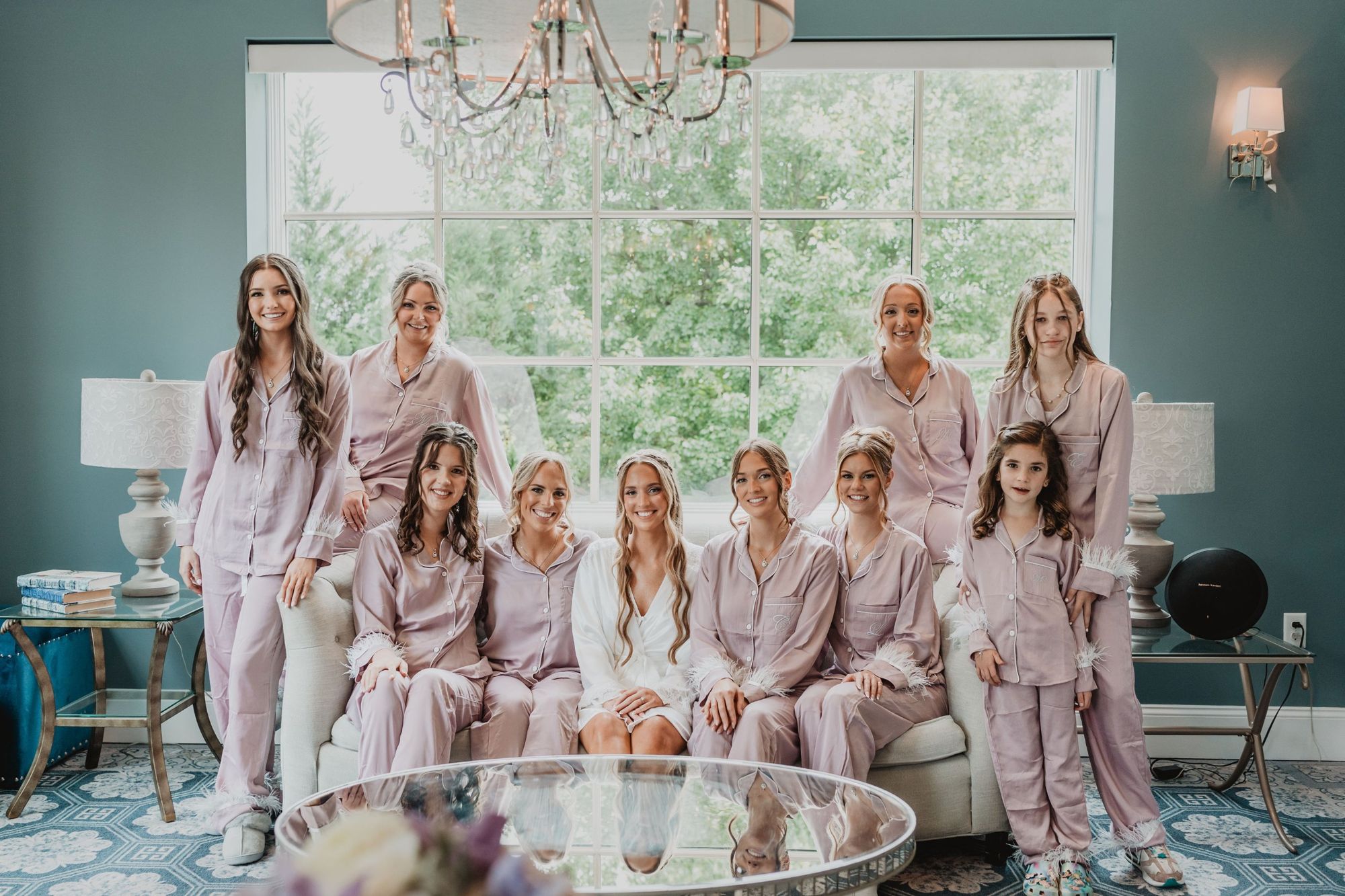 Bride and bridal party in matching pajamas in the bridal suite